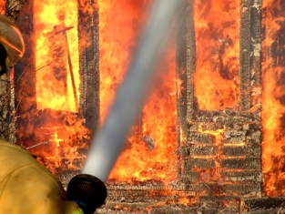 This dramatic photo of a firefighter fighting a fire was taken by Brad Harrison of Pierceland, Canada. 